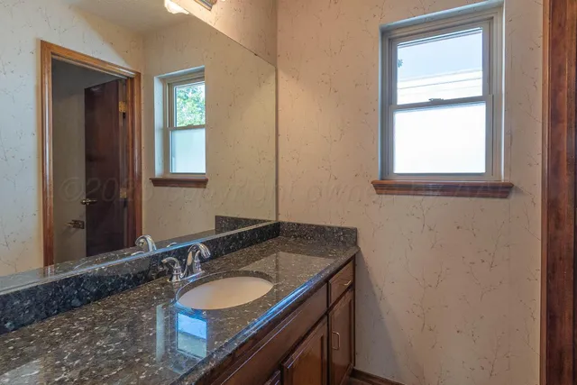 a view of a lake with houses in the back