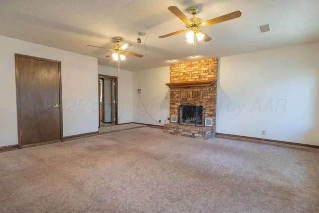 a kitchen with granite countertop a stove and a sink