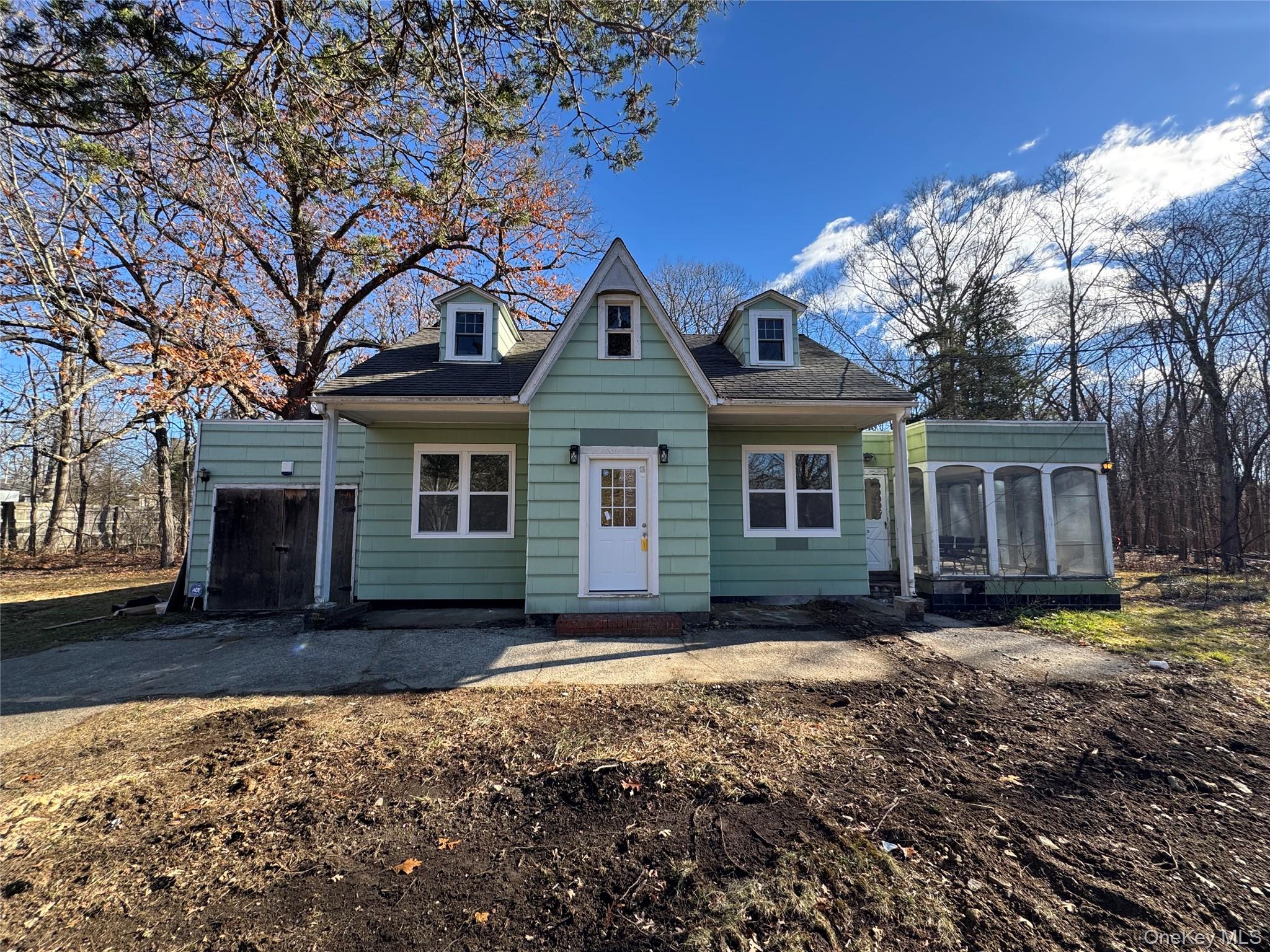 68 Chapel Road Newburgh, NY 12550 - Photo 1 of 17 a front view of a house with a yard