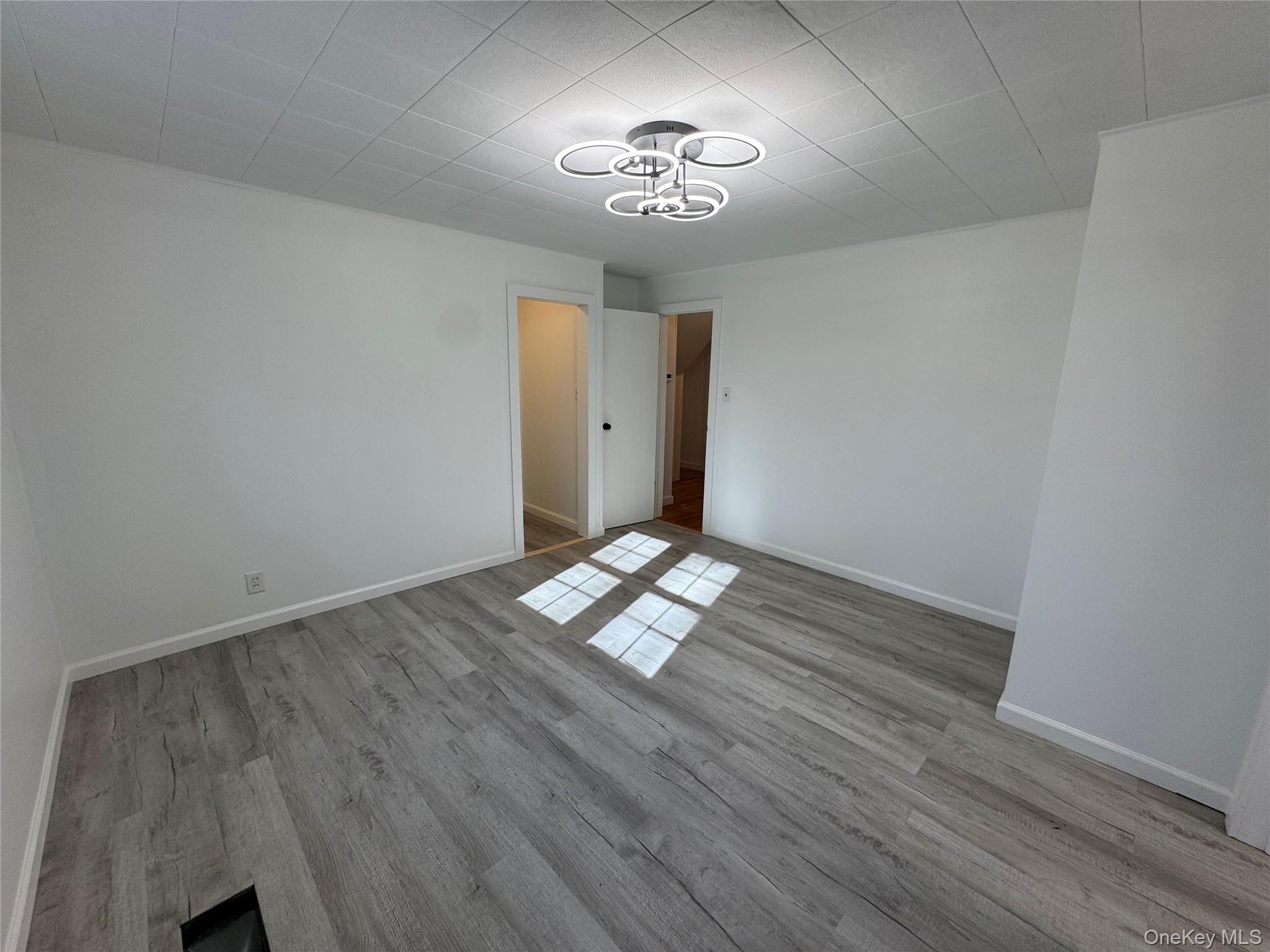 68 Chapel Road Newburgh, NY 12550 - Photo 12 of 17 a view of empty room with wooden floor