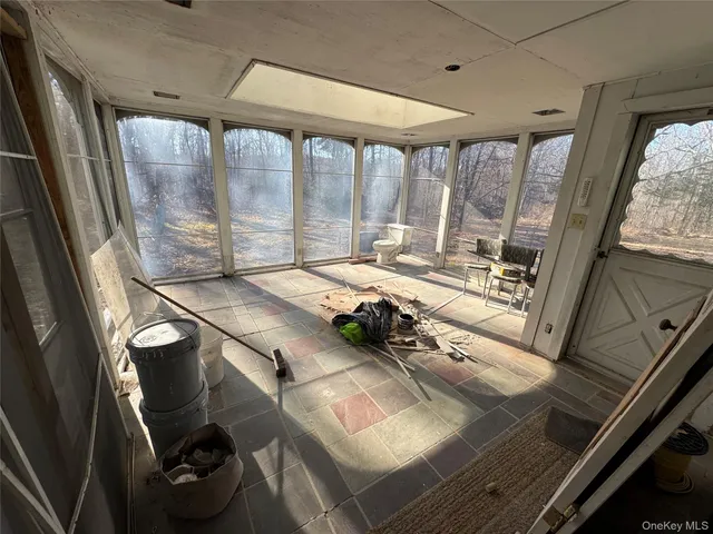 a room with furniture and a large window