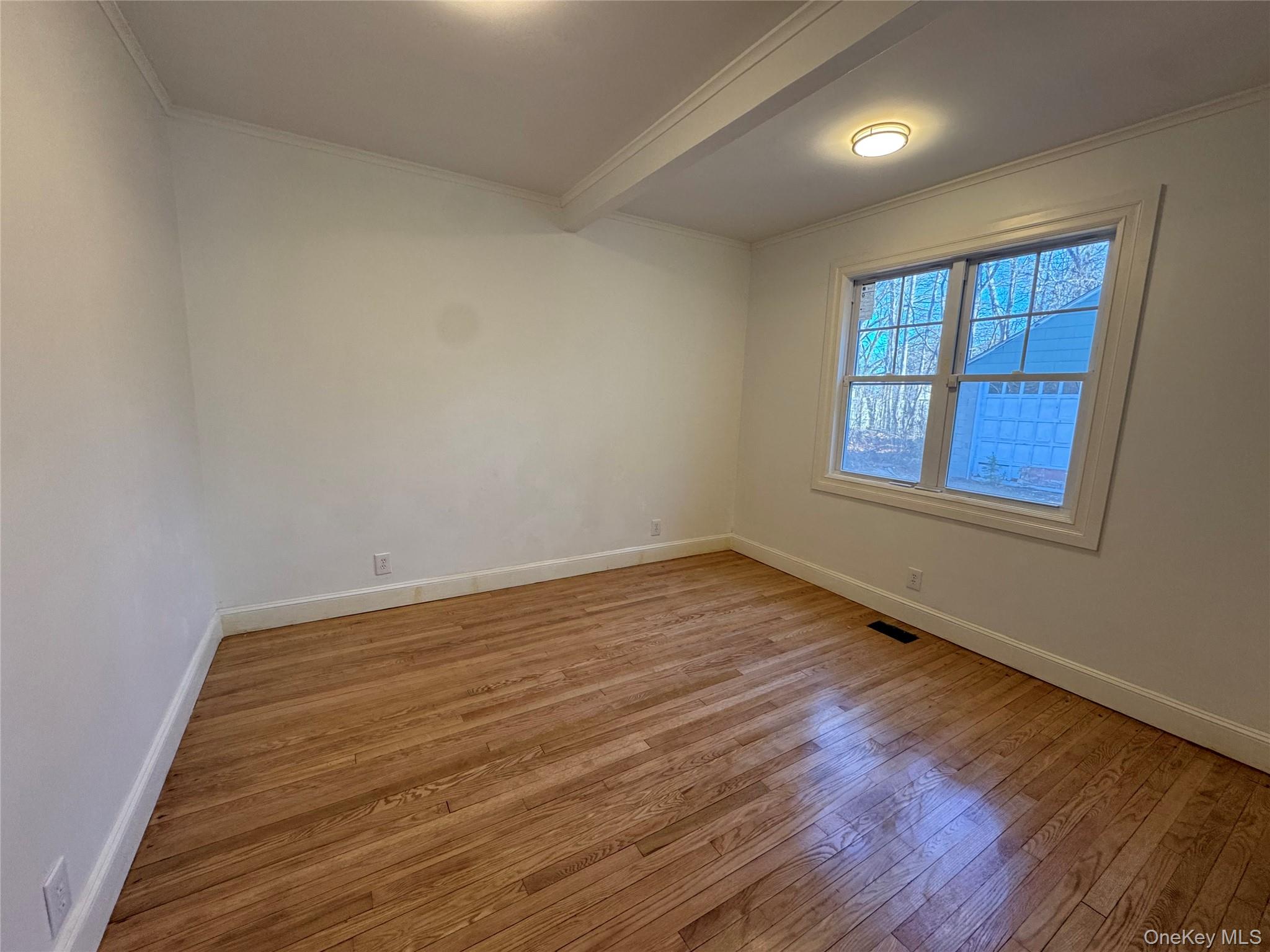 68 Chapel Road Newburgh, NY 12550 - Photo 8 of 17 wooden floor in an empty room with a window