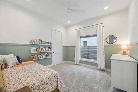 a bedroom with a bed and a cabinets