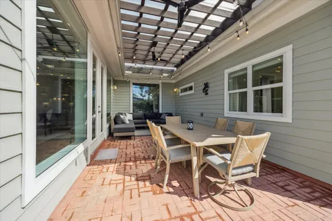 a patio with table and chairs