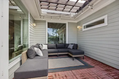 a view of a patio with furniture