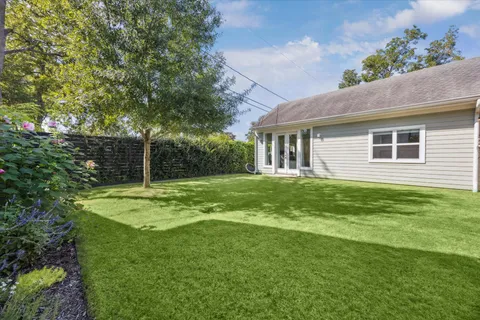 a house view with a garden space