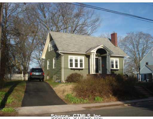 76 Westminster Road Manchester, CT 06040 - Photo 1 of 1 a front view of a house with a yard