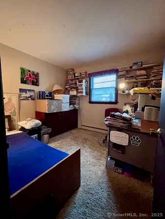 a room with furniture pool table and window