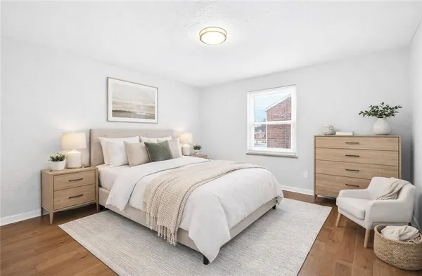a bedroom with a bed and a dresser