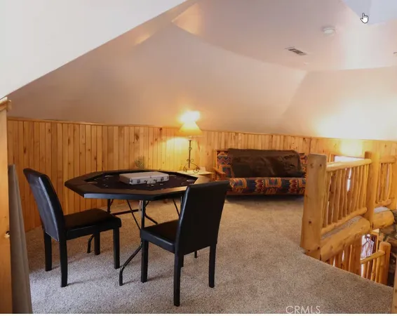 a view of a chairs and table in patio