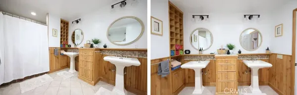 a bathroom with a double vanity sink and a mirror