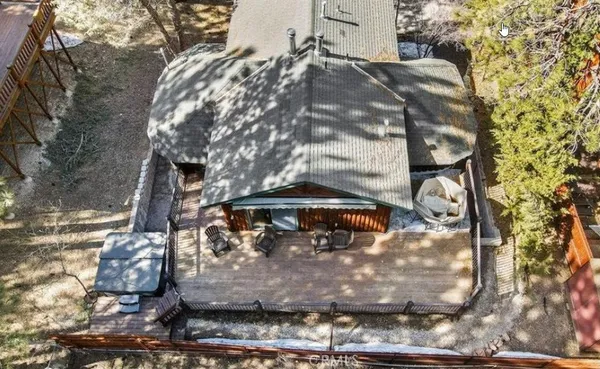 a view of a tall building with large trees