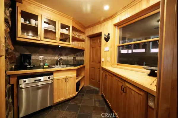 a kitchen with stainless steel appliances granite countertop a stove and a sink