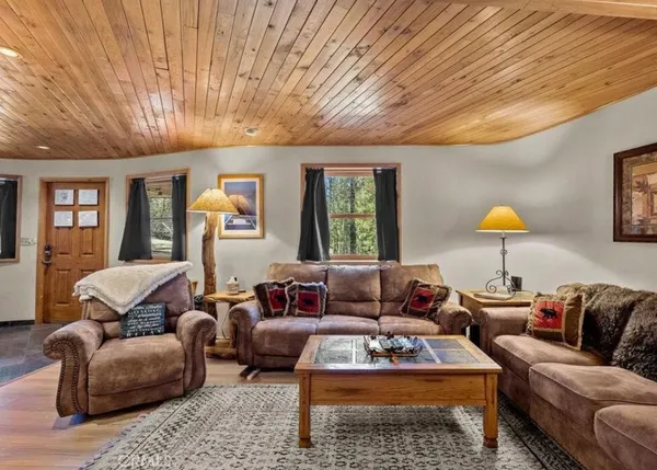 a living room with furniture and a lamp