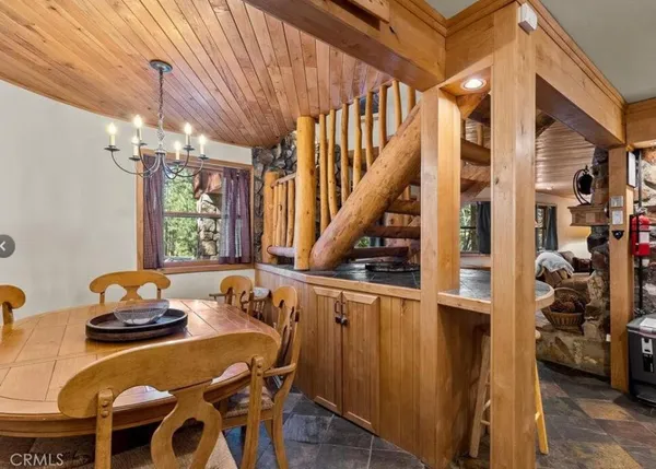 a dining room with furniture and window