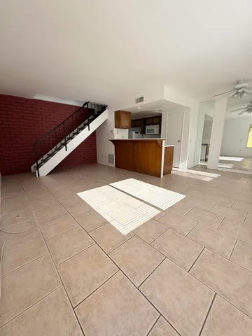 a view of kitchen with furniture and a fireplace