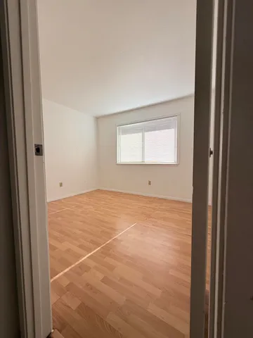 a view of an empty room and window