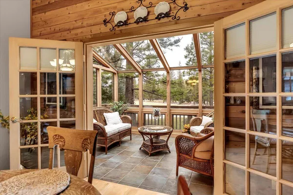 a outdoor living space with furniture and a floor to ceiling window