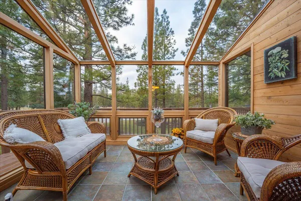 a backyard of a house with outdoor seating