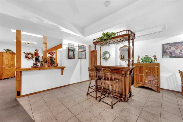 a room with table chairs and entryway