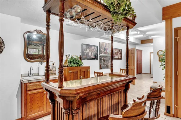 a room with counter top space and painting on the wall