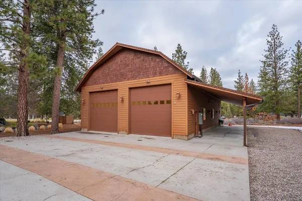 a view of a livingroom with furniture and a large window