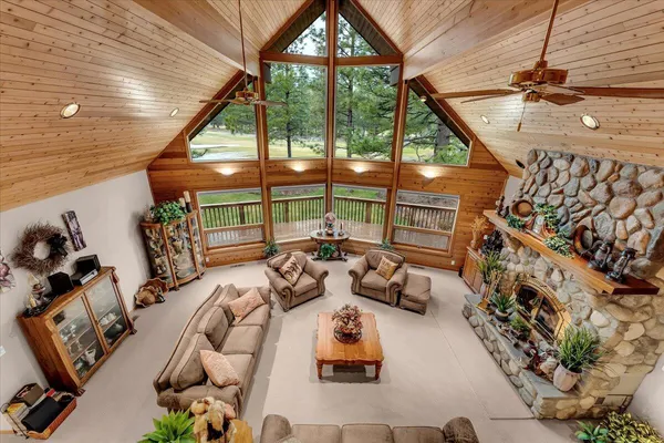a living room with furniture and a chandelier
