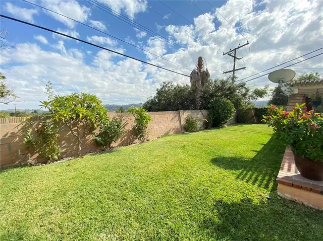 a view of yard with swimming pool