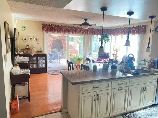a kitchen with counter space and a chandelier