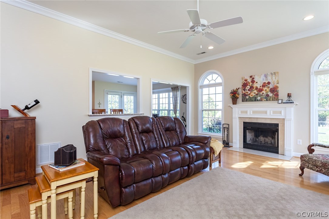 102 West Ridge Court Keswick, VA 22947 - Photo 13 of 48 a living room with furniture a fireplace and a chandelier