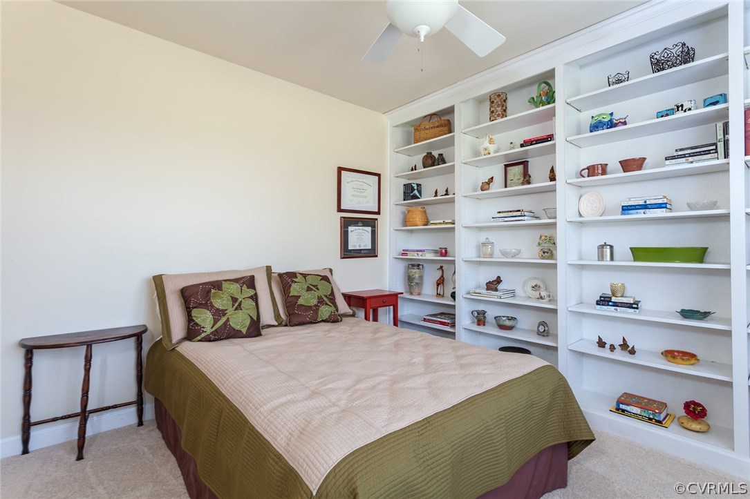 102 West Ridge Court Keswick, VA 22947 - Photo 31 of 48 a bed room with a bed and a book shelf