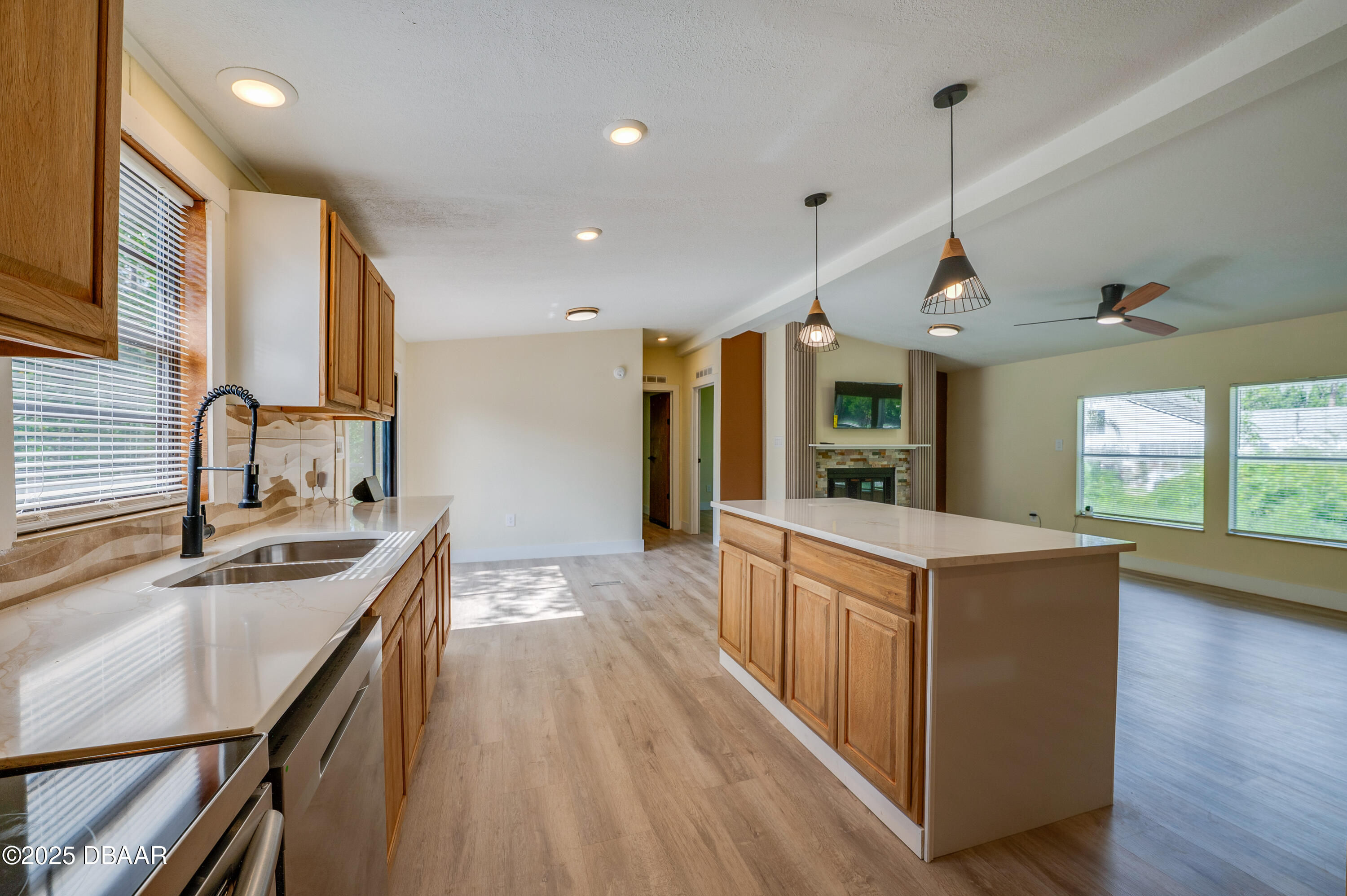 3669 General Marshall Road Daytona Beach, FL 32124 - Photo 14 of 32 a kitchen with stainless steel appliances granite countertop a sink a stove and a wooden floors