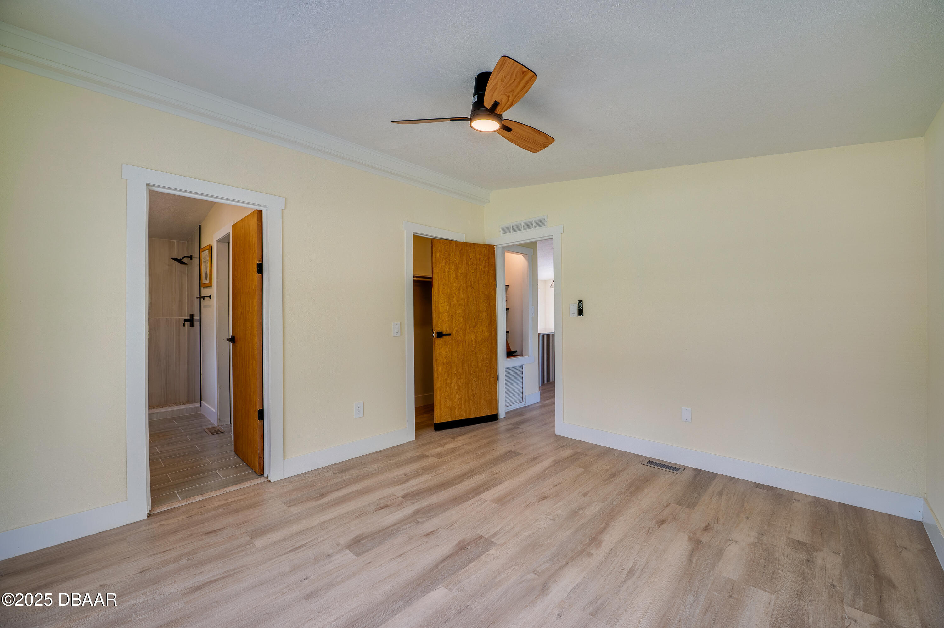 3669 General Marshall Road Daytona Beach, FL 32124 - Photo 18 of 32 a view of a livingroom with wooden floor and a ceiling fan