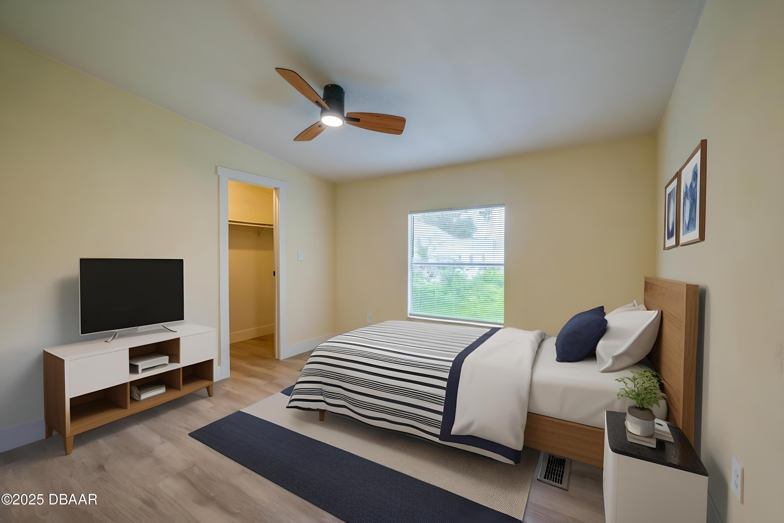 3669 General Marshall Road Daytona Beach, FL 32124 - Photo 20 of 32 a bedroom with a bed and a flat screen tv