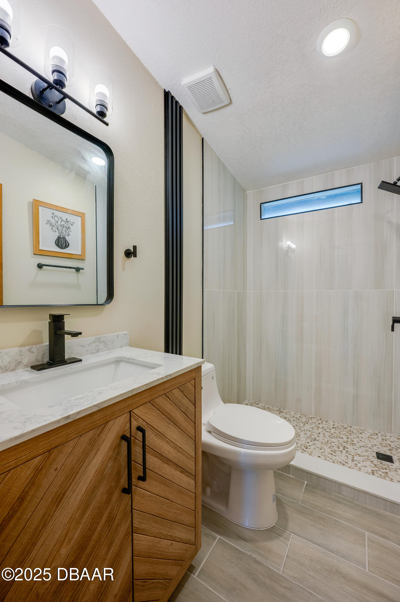 3669 General Marshall Road Daytona Beach, FL 32124 - Photo 26 of 32 a bathroom with a sink a toilet and shower