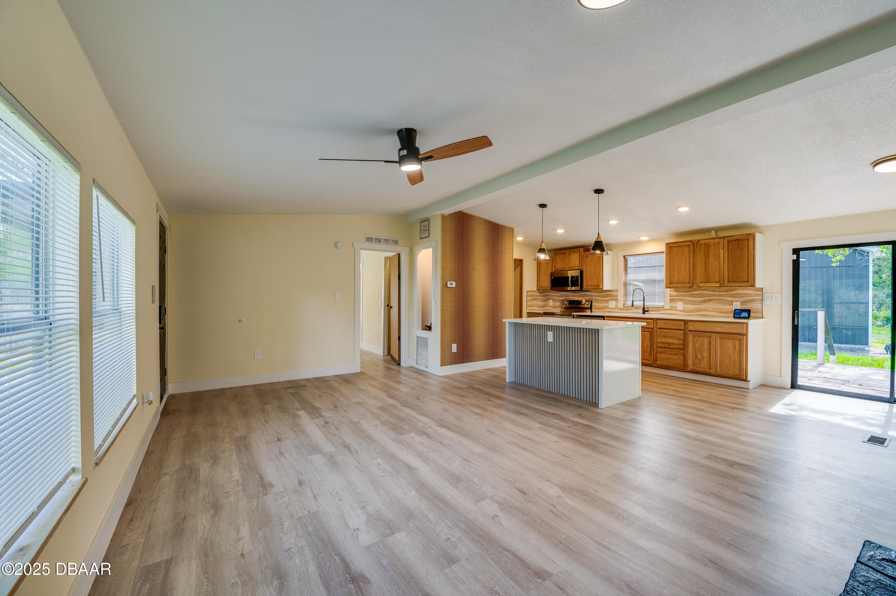 3669 General Marshall Road Daytona Beach, FL 32124 - Photo 9 of 32 a view of kitchen with wooden floor and windows