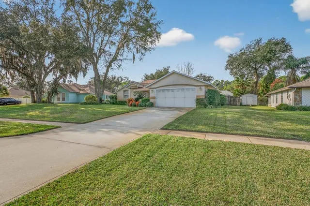 a view of a house with a yard