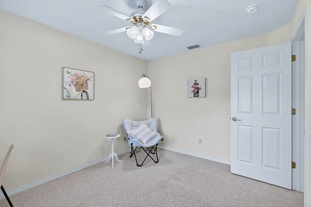 a view of a house with a tree in the background