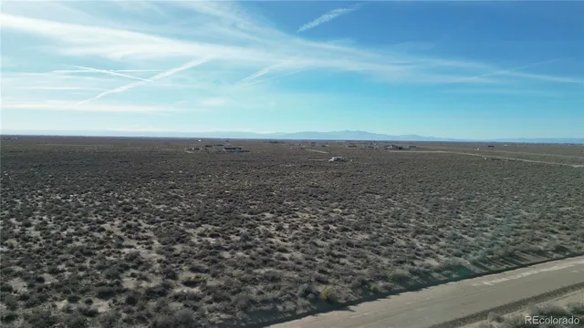 an aerial view of beach and city