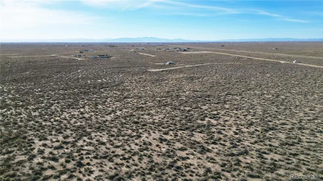 an aerial view of beach and city space