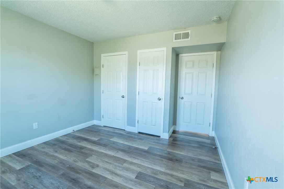512 Sunset Lane, Unit AD Copperas Cove, TX 76522 - Photo 9 of 23 a view of room with wooden floor