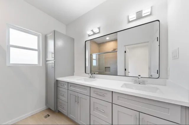 a bathroom with a glass shower door