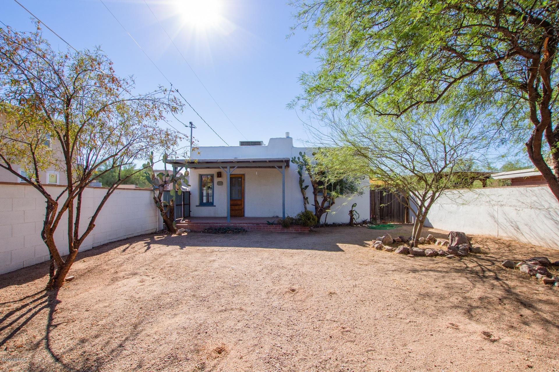 1020 East Halcyon Road Tucson, AZ 85719 - Photo 1 of 36 a view of a house with a yard covered in snow