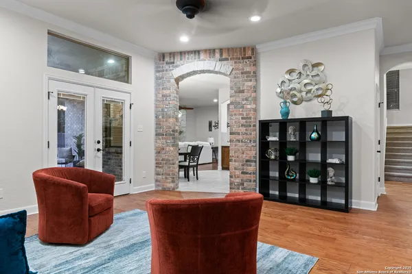 a living room with furniture a window and a fireplace