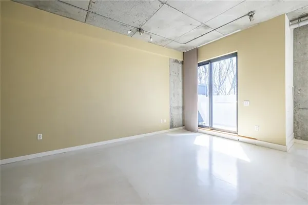 a view of an empty room with a window