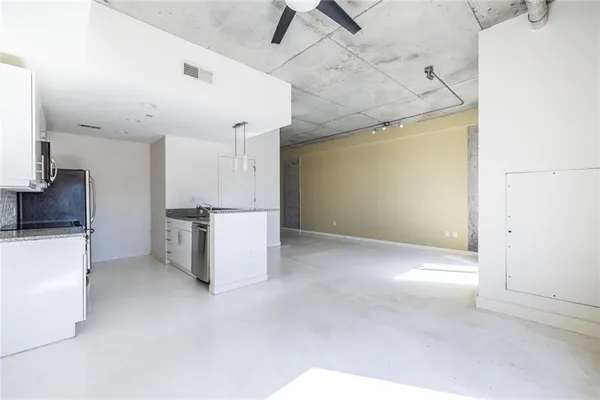 a view of a kitchen with a sink