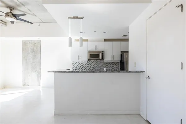 a view of a living room with a fireplace