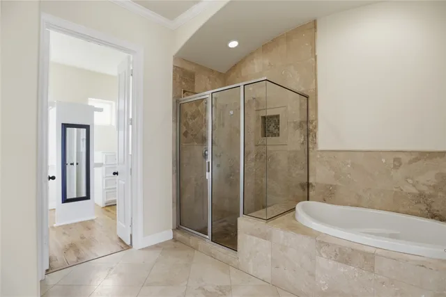 a bathroom with a shower and a tub