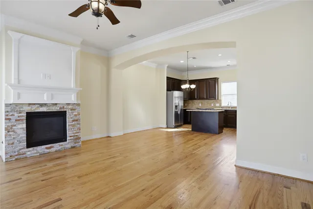 a view of a kitchen with a sink and a fireplace