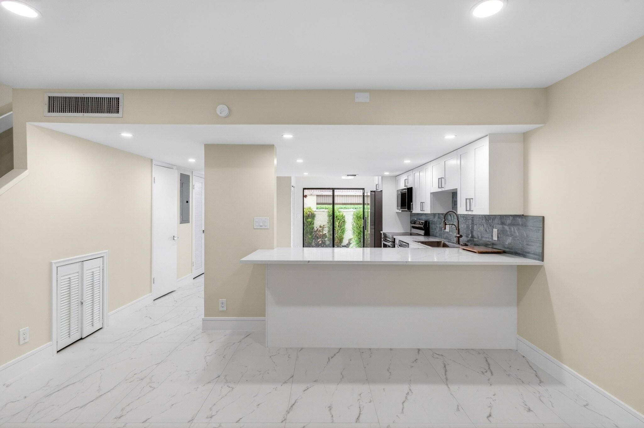 1330 Northwest 13th Street, Unit 12 Boca Raton, FL 33486 - Photo 10 of 52 a view of kitchen with refrigerator and window